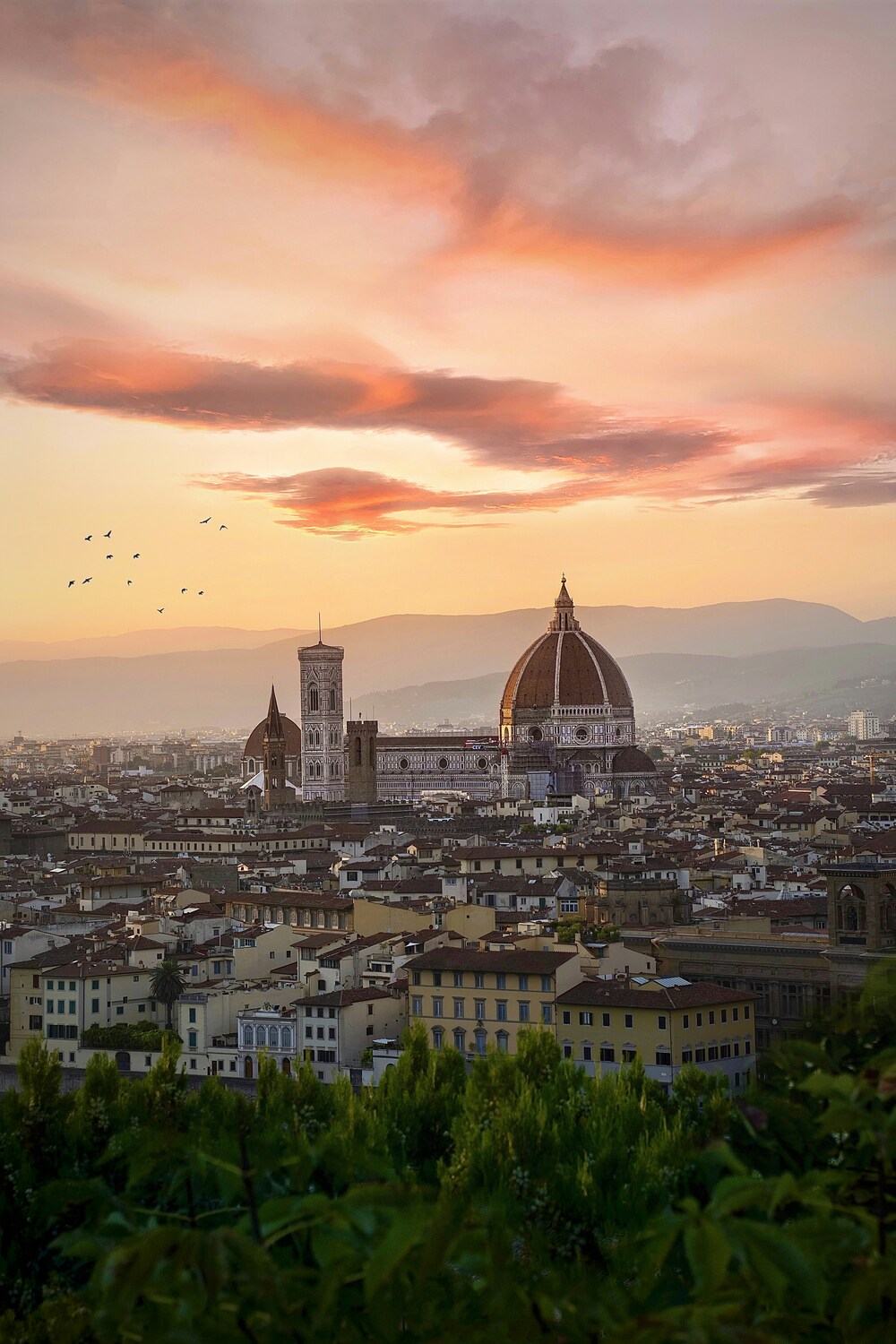 Italian city at sunset with a domed cathedral