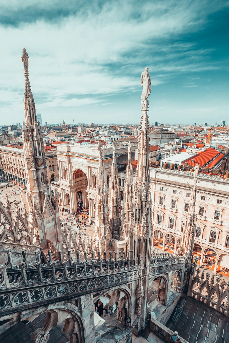Spires of the Duomo above the rooftops of Milan