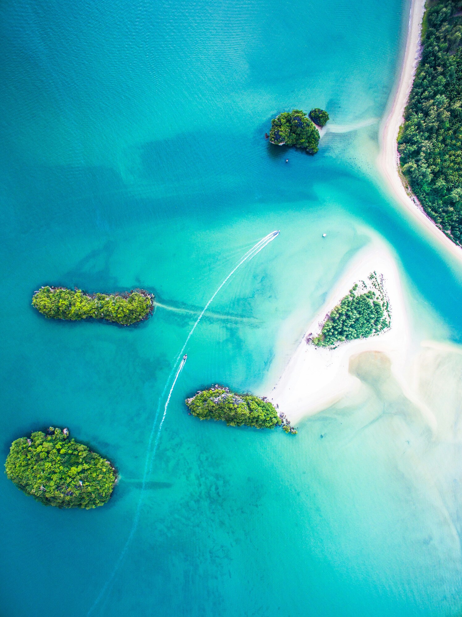 Aerial view of turquoise water and small tropical islands